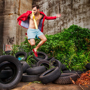 Alex Lago, model - Alex jumping over tires.