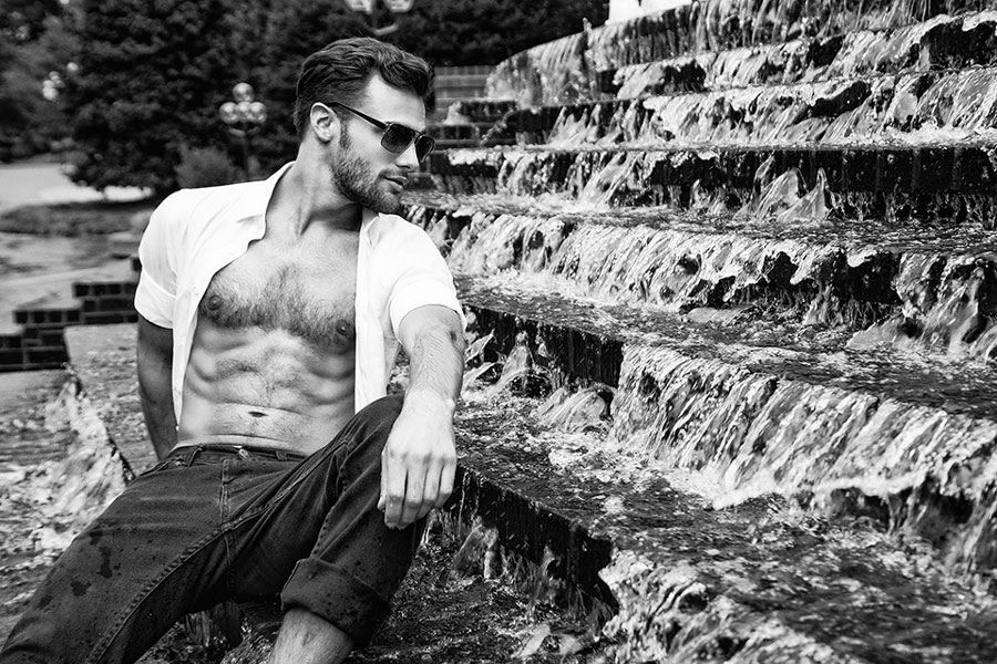 Alex Lago - model - Alex sitting by a fountain